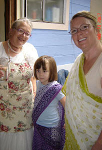 The backbone of the Soquel kitchen, Srimati Sureshvari Didi with her grandaughter Sage and daughter, Adisvara.