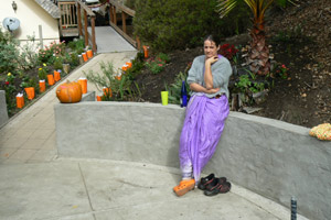 Uma Didi sitting on the wall she built.