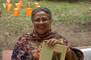 Diksavati Didi happily distributes our beautiful books.