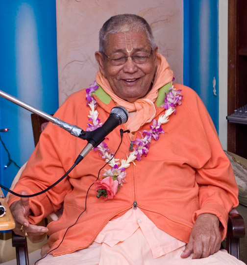 Then Srila Gurudev happily comes to the temple and speaks to all of the devotees and sings two songs.