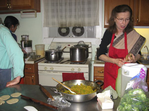 Srimati Jivana Didi always making sure the feast is going on nicely, she is very successful at her service.