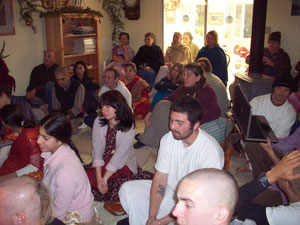 The devotees happily listen.