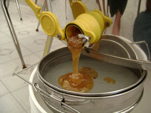 The honey is released through an open valve.