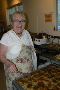 Sureshvari Didi always a pillar of support is seen here cooking the Aloo Tikis by the hundreds.