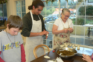 Sureshvari Didi prepared the Samosa filling and dough and here is seen teaching Jananivas and Leonardo how to roll.