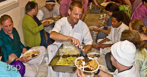 Giridhari Prabhu helps to serve the delicious feast.