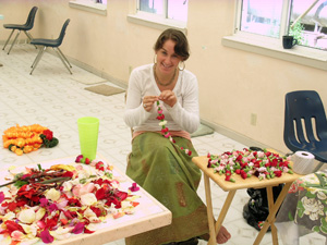 Rasangi, Diksavati and Nadiya Didis happily strung the many many garlands for decorating.