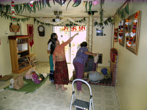 Meanwhile in the Temple room, Krishna Madhuri, Nalina Sundari and Diksavati Didis begin to design and hang the garlands.