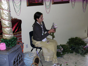 Mahadevi helps with the flower decorations.