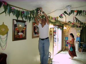 Adi Kesava Prabhu assists in hanging the garlands too.