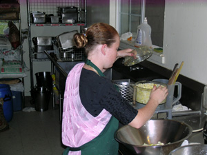 Kumari Devaki helps with the cooking preparations.