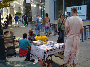 Kamal Krsna handed out invitations to the Temple.