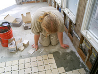 Ramachandra Prabhu working with talented craftsmanship to lay out the new floor.