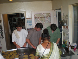  Ramananda and Shatrughna Prabhus, Divyashakti Didi and Gaur Nataraj Prabhu roll puris.