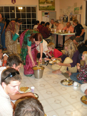 Satyabhama Devi Dasi serves the dahl