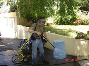 Hasyapriya Prabhu gets out the power washer.