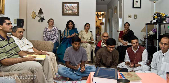 Devotees and friends gathered in the home of Jairam Prabhu.