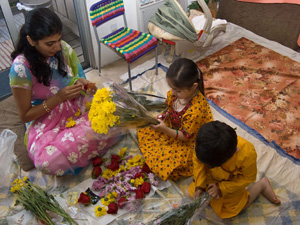 Monica, Lavanika and and Nabh string garlands for the festival.