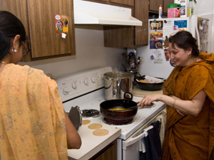 Abha Devi Dasi happily fries puris. 