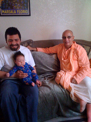 Devotees and friends gathered in the home of Harindhu Prabhu and Rasa Rajani Devi Dasi.