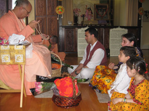 Jairam Prabhu surrounded by his family receives Srila Gurudev's divine connection via Sripad Janardan Maharaj.