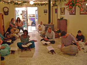 The devotees and guests gathered in the temple room.