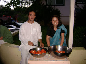 Dhruva and Saci help with the kitchen seva.