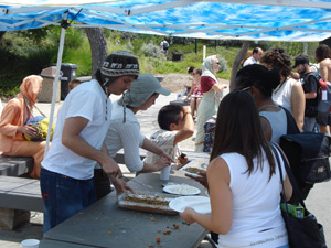 Nowla Kishor Prabhu serves out the apple caramel cake.