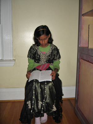 Sita reads attentively.