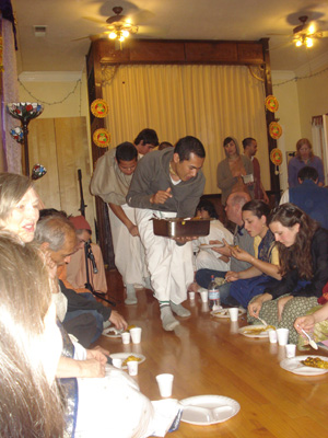 and serving Mahaprabhu's Prasadam to the devotees.