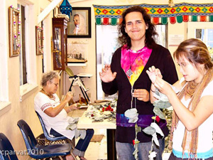 Amrita Didi and Lennon  helps with the decorations.