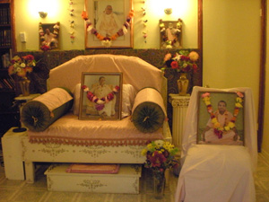 The temple room and the Vyasasana have many beautiful garlands.