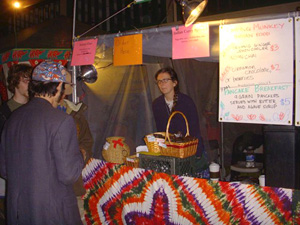 Sushila Didi taking orders for plates of rice, dahl, sabji, chutney, and salad.  We also offered hot and cold drinks and Krishna Madhuri Didi's popular vegan cakes.