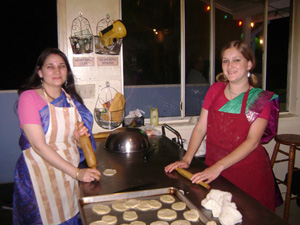 Abha Didi and Satyabhama Didi roll puris.