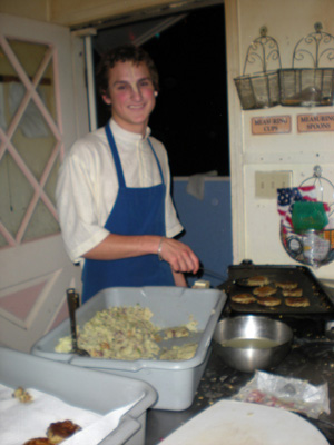 Ramananda Prabhu helps fry the tikkis.