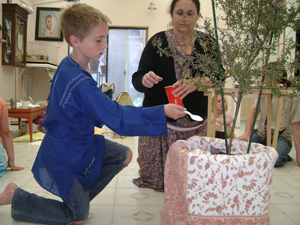 Gopala Bhata Prabhu watering Srimati Tulasi Devi.