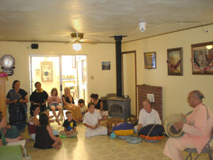 Sripad Janardan Maharaj continues his class by telling stories of Krsna and the many demons He killed.