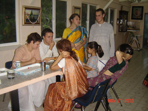 The devotees take a break in the prasadam hall.