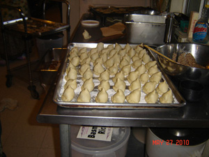 Samosas are prepared for the grain feast next day.