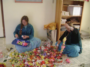 Laksmipriya Didi and Madhumati helped to make the many garlands.