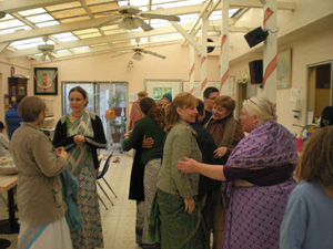 The devotees happily welcomed each other.