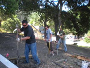 Prabhus Harindhu, Shatrughna and Gaur Nataraj start to dig the trenches for the next section of retaining wall.