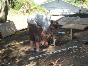 Shatrughna Prabhu helps with the measurements.