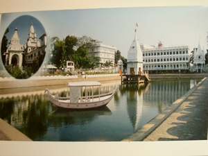 A beautiful composite photo of the Navadwip Math complete with Sri Govinda Kund and the famous domes of the Deity Mandir and the Samadhi Mandir adorn the wall of the Temple room.