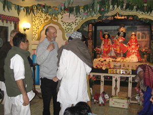 Navadwip Prabhu  affectionately reunites with some dear friends before honoring Prasadam.