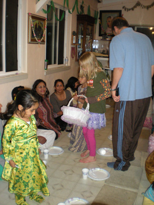 Shivani and Anjali take the donation basket. 