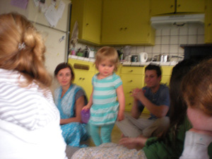 Gaura and Malika look on pleased as Jahanava plays with one of the young devotees.